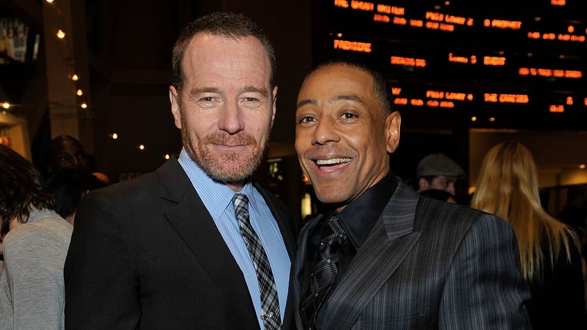 Breaking Bad stars Bryan Cranston and Giancarlo Esposito smile at movie theater.