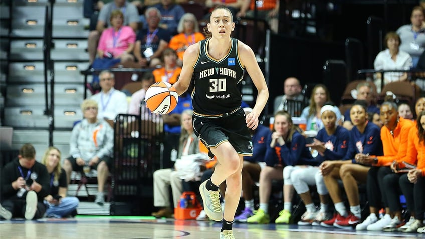 Breanna Stewart dribbles