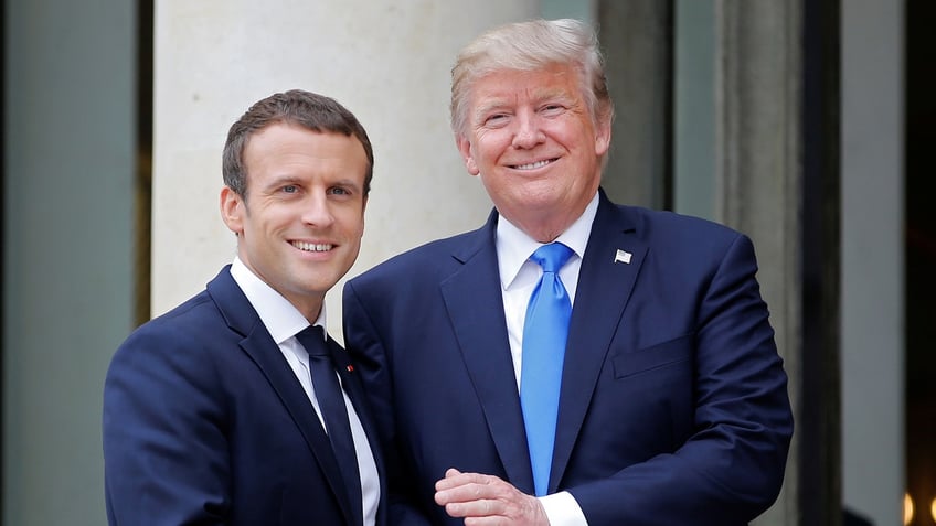 French President Emmanuel Macron greets U.S. President Donald Trump at the Elysee Palace in Paris, France, July 13, 2017. REUTERS/Stephane Mahe - RTX3BBC8