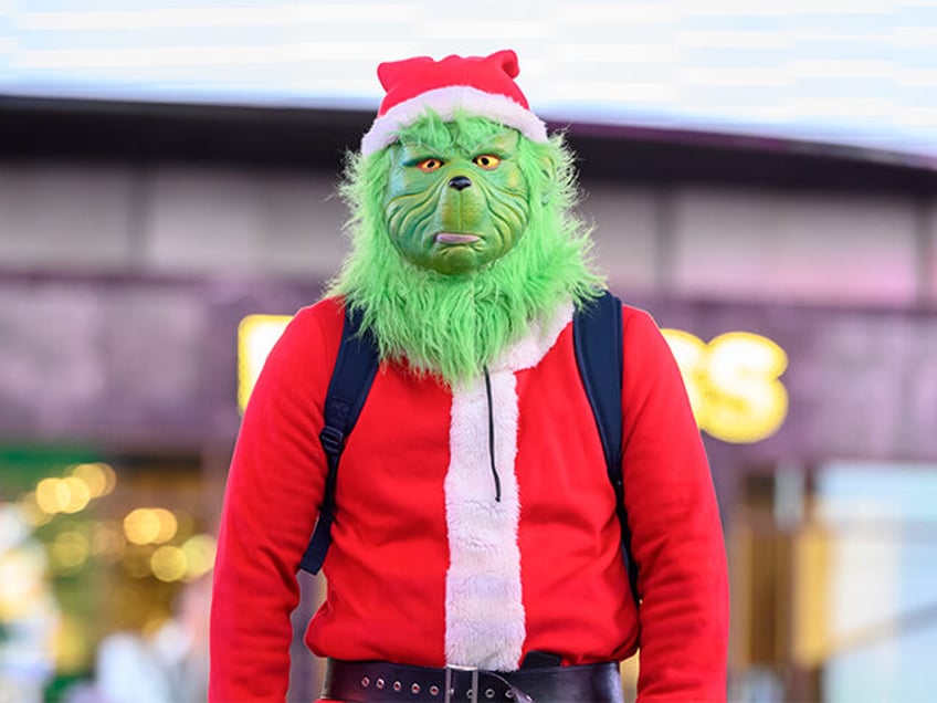 The Grinch visits Times Square on December 06, 2020 in New York City. Many holiday events have been canceled or adjusted with additional safety measures due to the ongoing coronavirus (COVID-19) pandemic. (Photo by Noam Galai/Getty Images)