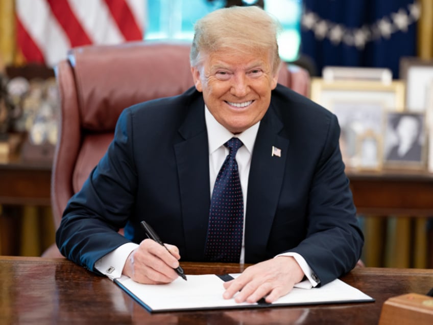 President Donald J. Trump signs a Presidential Memorandum on Protecting the United States Lobster Industry on Wednesday, June 24, 2020, in the Oval Office of the White House. (Official White House Photo by Shealah Craighead)