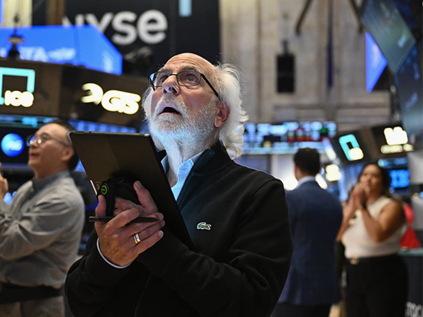 Traders work on the floor of the New York Stock Exchange in New York on August 23, 2024. (