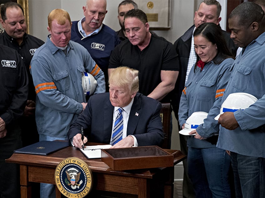 President Donald Trump signs a proclamation on adjusting imports of steel into the United