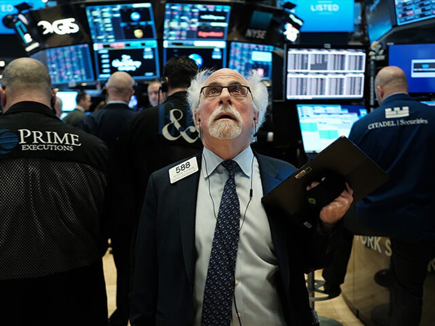 NEW YORK, NEW YORK - MARCH 09: Stock trader Peter Tuchman works on the floor of the New Yo