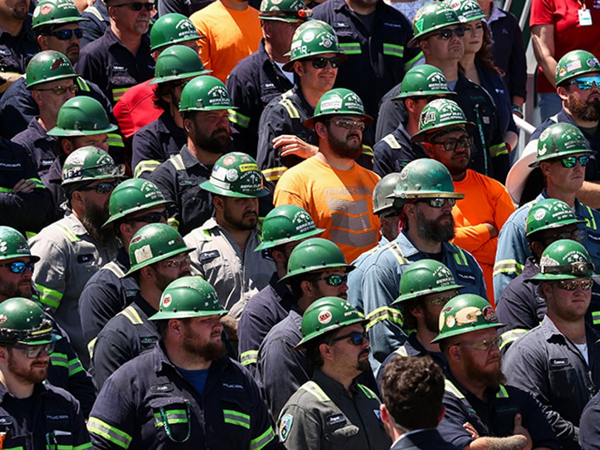 Workers listen as Vice President JD Vance speaks at Nucor Steel Berkeley in Huger, South C