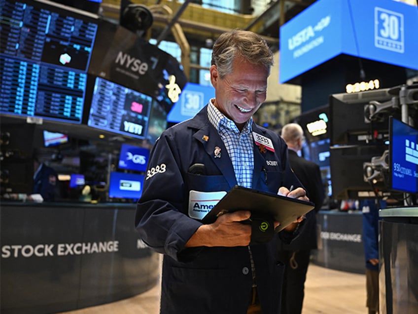 Traders work on the floor of the New York Stock Exchange (NYSE) during morning trading in