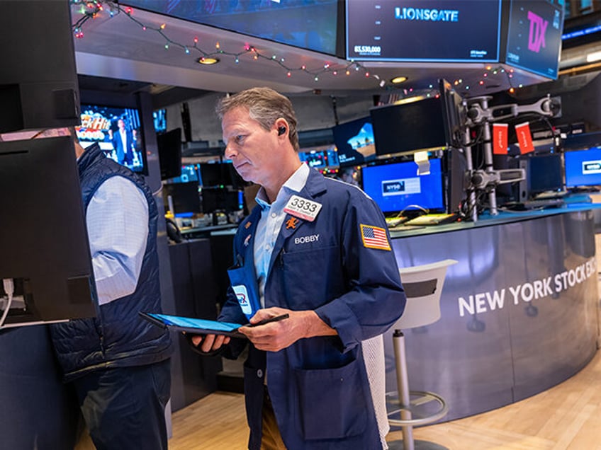 Traders work on the floor of the New York Stock Exchange (NYSE) on the first day back since the Christmas holiday on December 26, 2023, in New York City. (Spencer Platt/Getty Images)