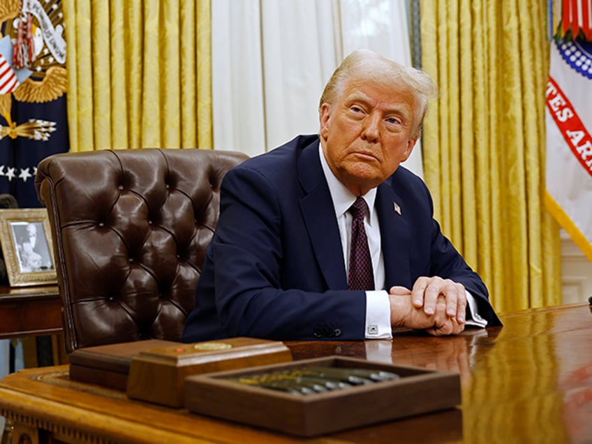 President Donald Trump speaks to reporters after signing a series of executive orders in t