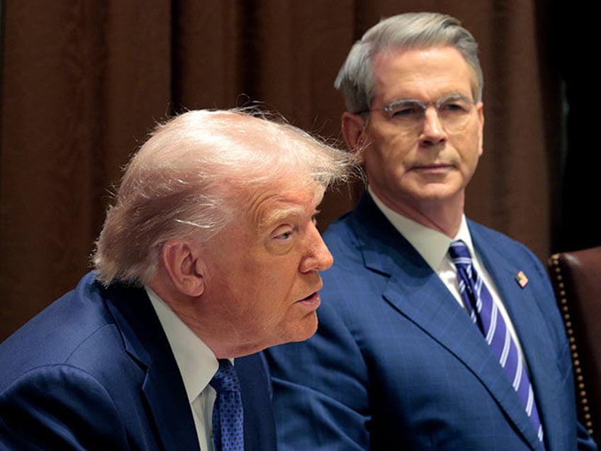 U.S. Treasury Secretary Scott Bessent listens as U.S. President Donald Trump delivers rema
