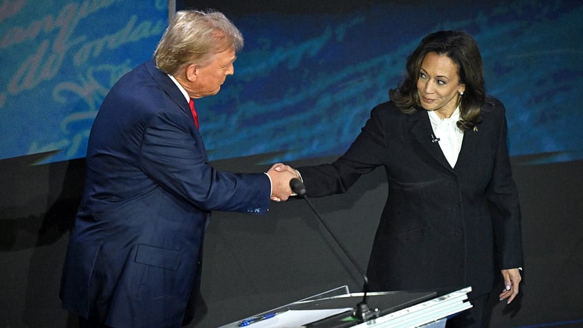 Trump and Harris shake hands