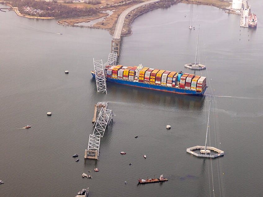 In an aerial view, cargo ship Dali is seen after running into and collapsing the Francis S