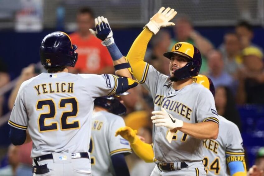 brewers ride 12 run inning to victory punch mlb playoff ticket