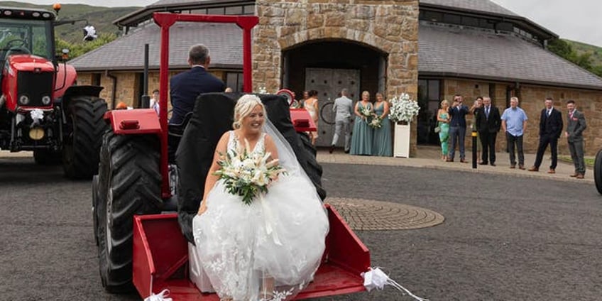 bridal haul woman arrives for her wedding on the back of a tractor laughed the whole way