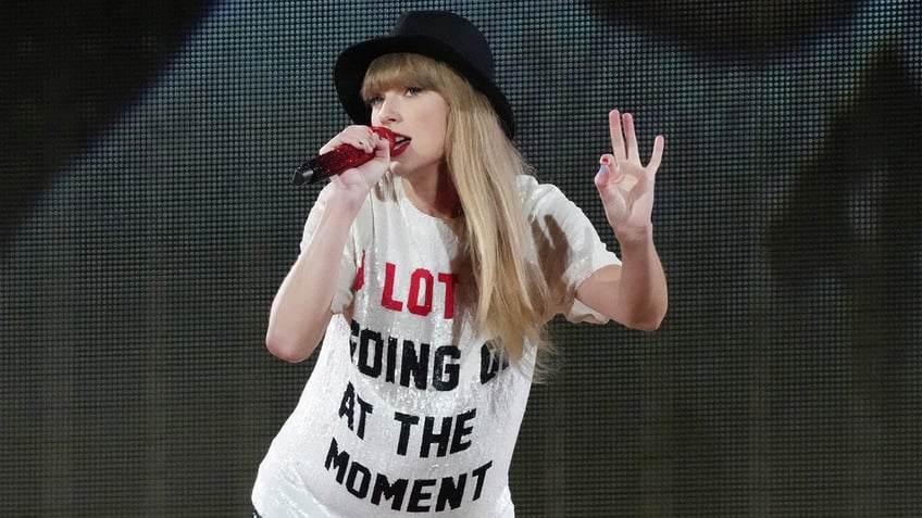 woman singing into microphone