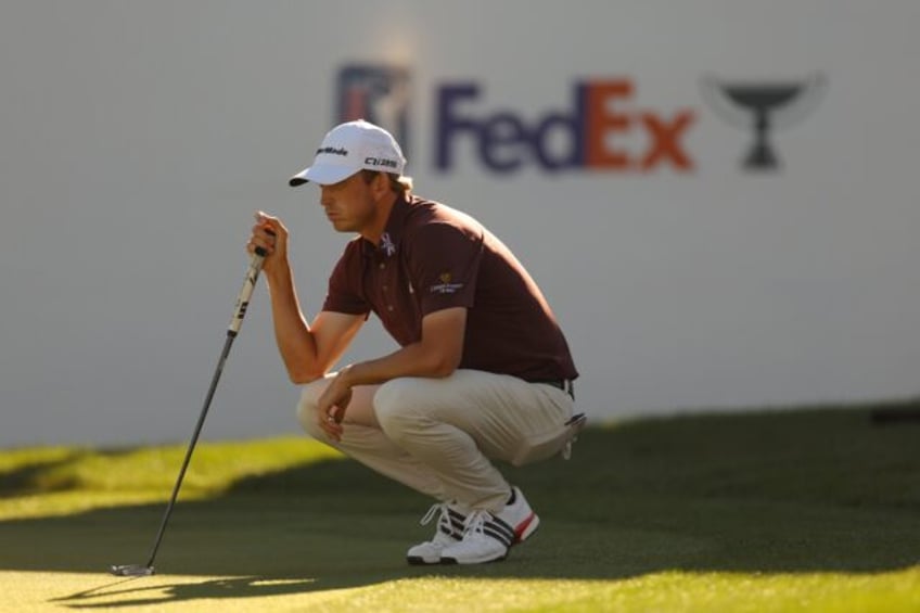 Jacob Bridgeman lines up a putt on the 18th green at the PGA Tour's Valspar Championship