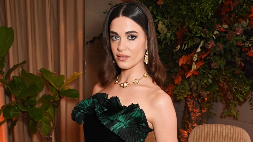 "Bridgerton" star Genevieve Chenneour wearing a strapless, green dress