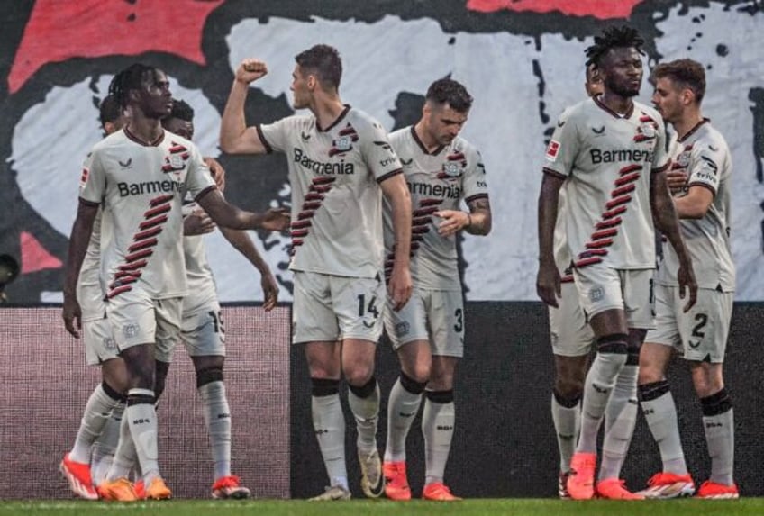 Bayer Leverkusen forward Patrik Schick clenches his fist after scoring the opener in Sunda