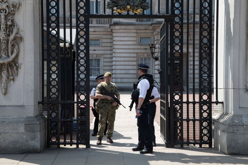 british army drafted in as armed police hand in guns in protest at officer charged with murder