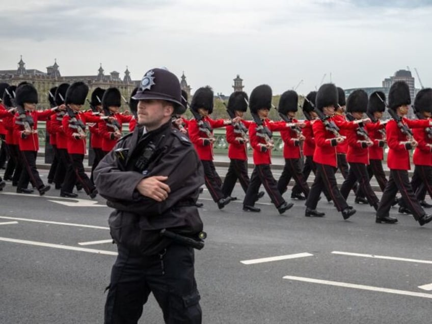 british army drafted in as armed police hand in guns in protest at officer charged with murder