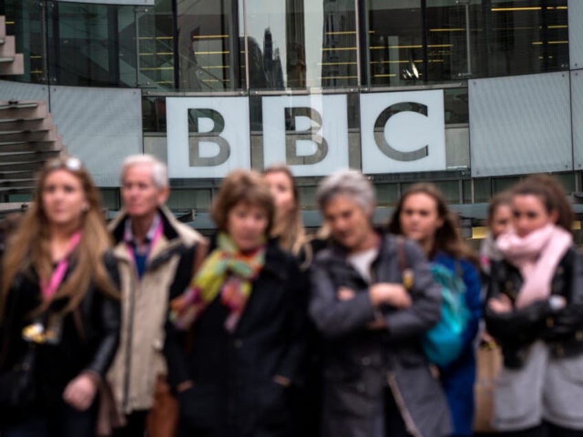 LONDON, ENGLAND - MARCH 25: People walk past Broadcasting House, the headquarters of the B