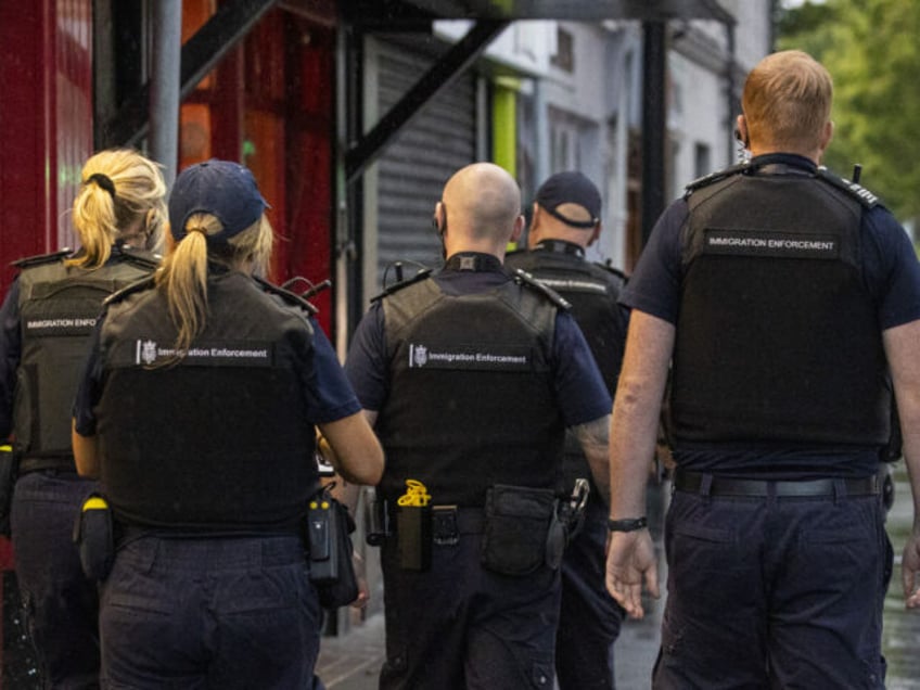 Immigration enforcement officers take part in an immigration raid in Warrenpoint in County