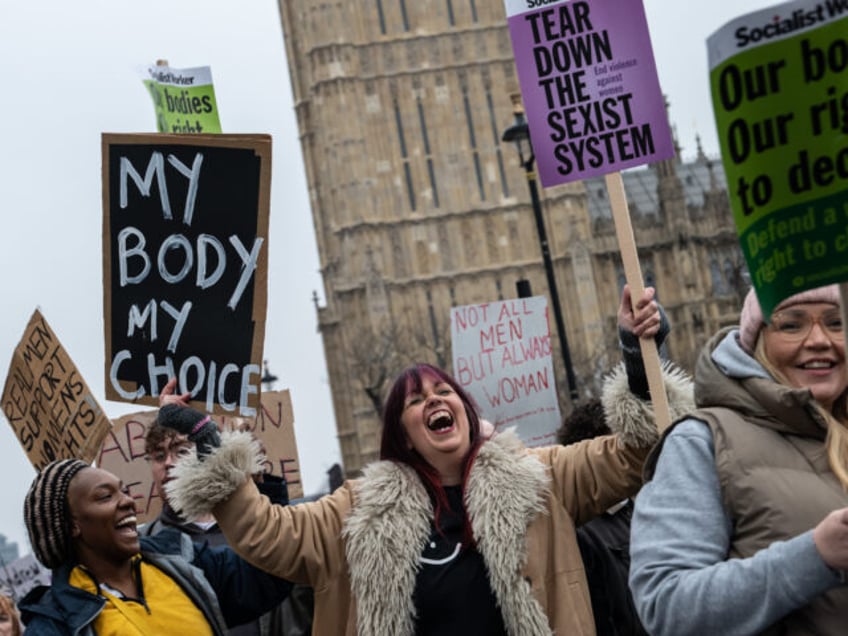 LONDON, ENGLAND - JANUARY 18: The UK Women's March passes Parliament on January 18, 2025 i