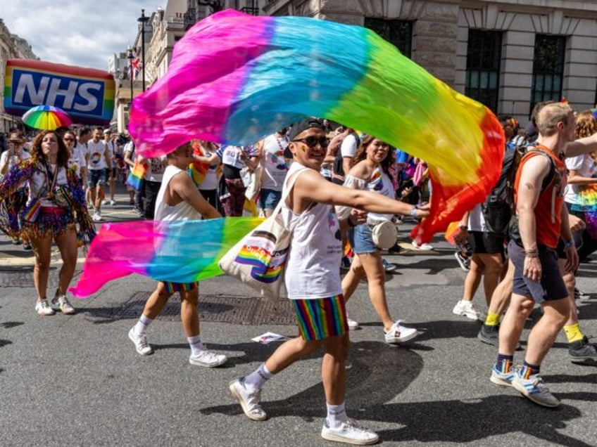 NHS workers take part in the Pride in London parade on 1 July 2023 in London, United Kingdom. Over a million people watched the 51st annual Pride parade in which an estimated 30,000 people took part from over 600 organisations including many LGBT+ community groups. (photo by Mark Kerrison/In Pictures …