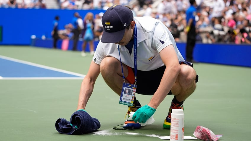 A court attendant cleans up 