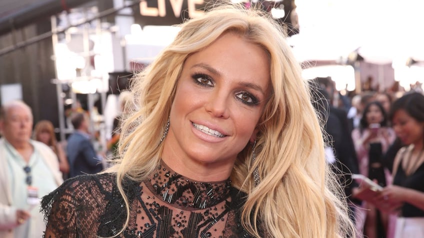 Britney Spears sports sheer black dress on red carpet