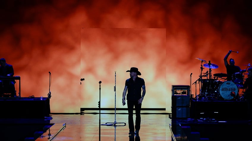 Jason Aldean wearing all black as he performs at the Liberty Ball in honor of President Donald Trump.