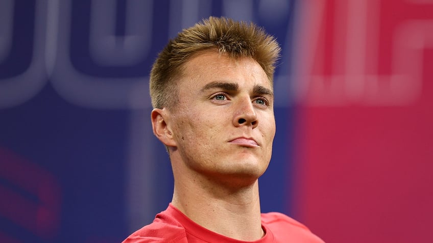 Bo Nix looks on at Combine