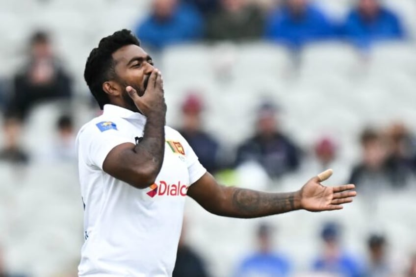 Enjoyed that: Sri Lanka's Asitha Fernando blows a kiss as he celebrates his dismissal of E