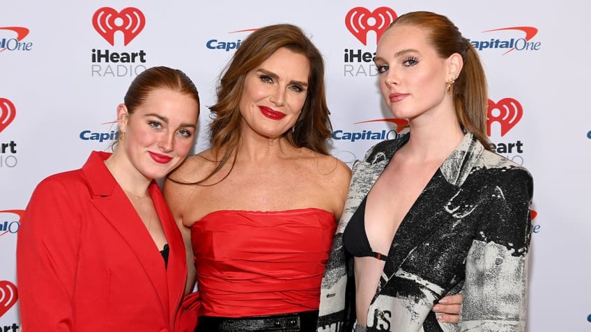 brooke shields on red carpet with daughters grier and rowan