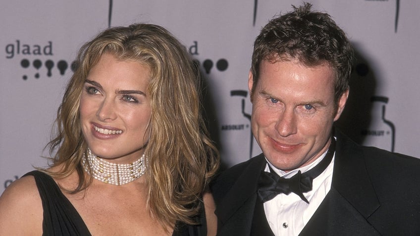 Brooke Shields and Chris Henchy wear black tie attire