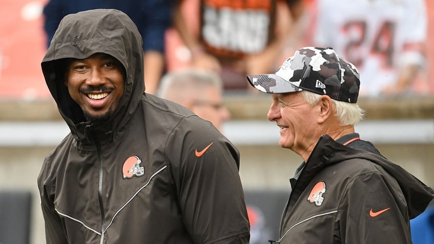 Myles Garrett interacts with Jimmy Haslam