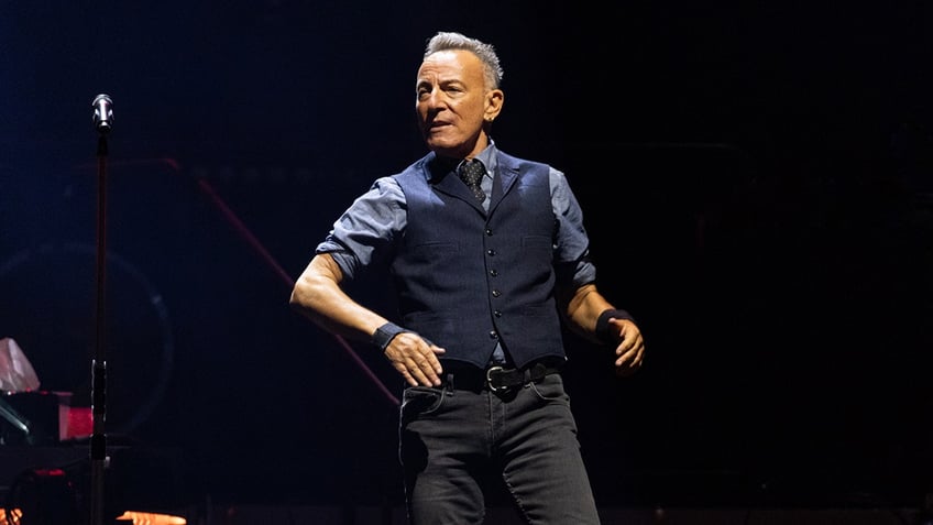 Bruce Springsteen standing on stage