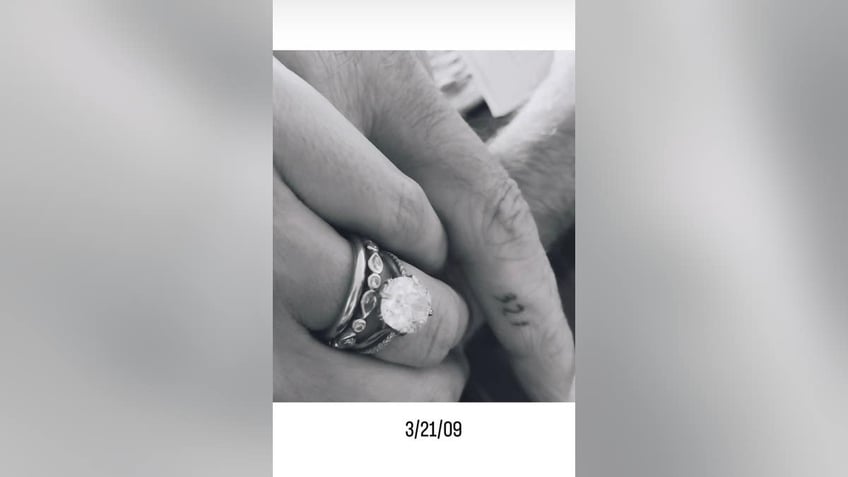 black and white close-up of emma heming willis wedding rings
