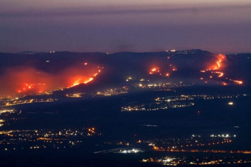 Fires burn in northern Israel as a result of rockets launched from Lebanon amid cross-bord