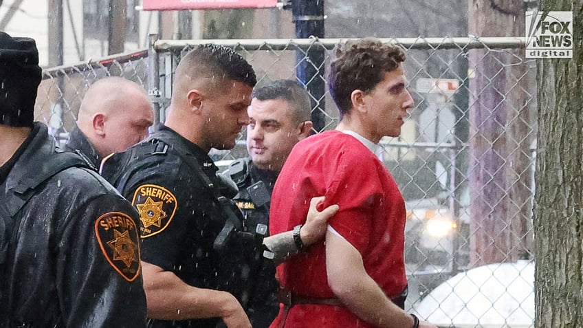 Bryan Kohberger wears red jumpsuit as he walks to court house