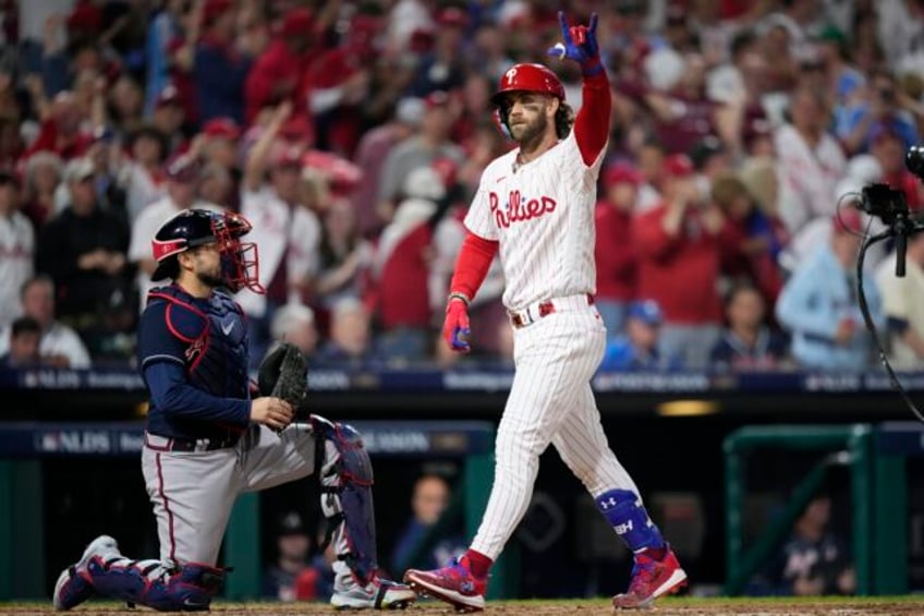 bryce harper slugs 2 more homers as phillies pound braves 10 2 in game 3 of nl division series