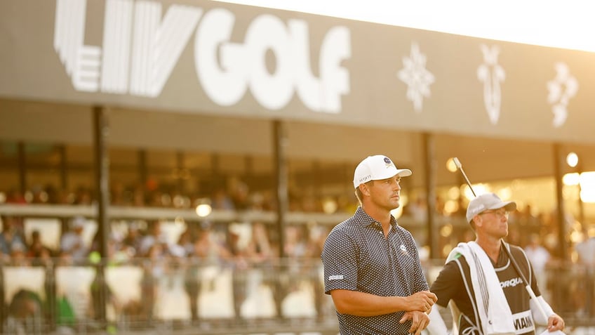 Bryson DeChambeau looks on