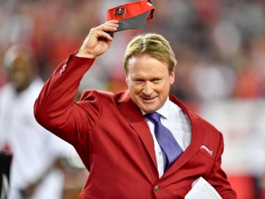 TAMPA, FL - DECEMBER 18: Former Buccaneers coach John Gruden salutes the fans during his i