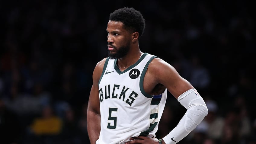 Malik Beasley looks on during an NBA game