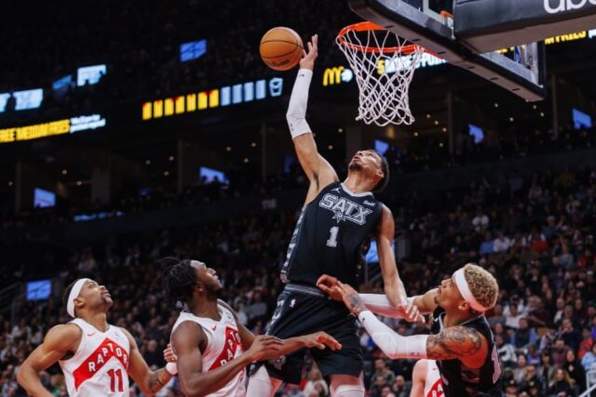 San Antonio's Victor Wembanyama leaps high for the ball in the Spurs' NBA victory at Toron