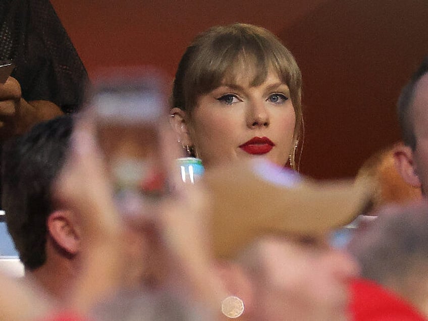 KANSAS CITY, MISSOURI - OCTOBER 12: Taylor Swift watches during the game between the Kansas City Chiefs and the Denver Broncos at GEHA Field at Arrowhead Stadium on October 12, 2023 in Kansas City, Missouri. (Photo by Jamie Squire/Getty Images)