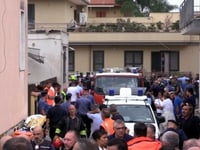 Building collapse in Italy kills 2 young siblings and their mother