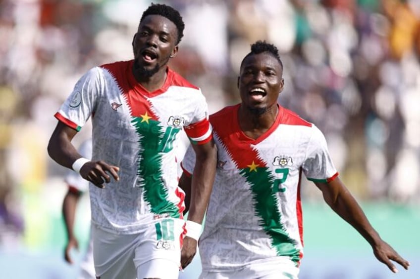 Bertrand Traore, with the number 10 shirt, celebrates scoring Burkina Faso's winner against Mauritania