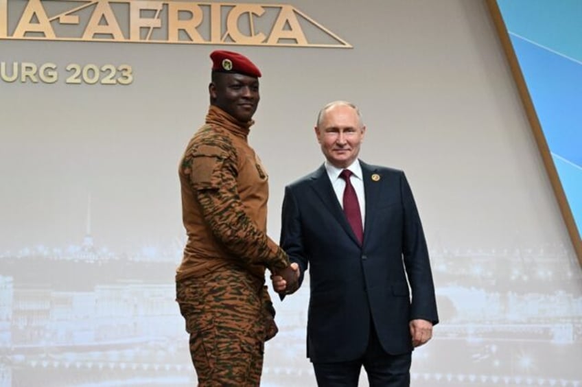 Burkina Faso's junta leader Ibrahim Traore, left, with Russian President Vladimir Putin i