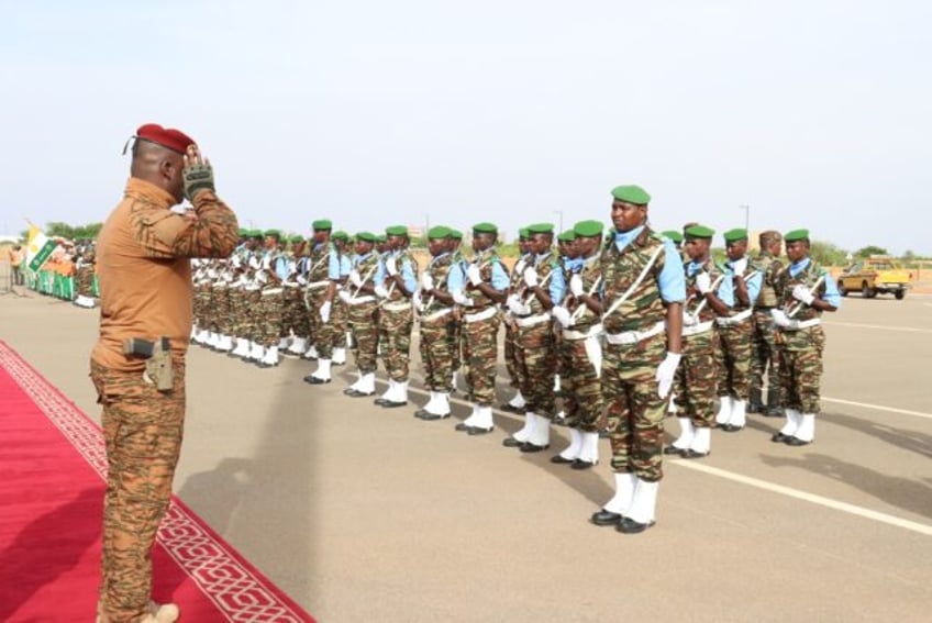 Burkina Faso's junta leader Captain Ibrahim Traore, seen saluting a guard of honour, insi