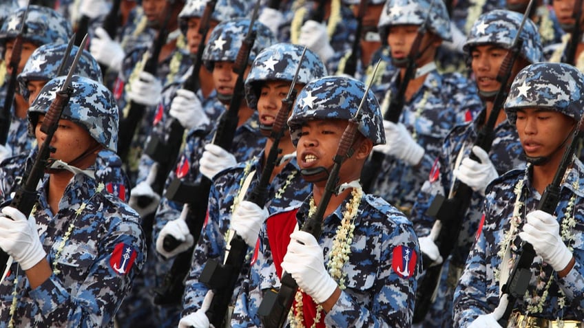 Burmese military officers marching in a parade